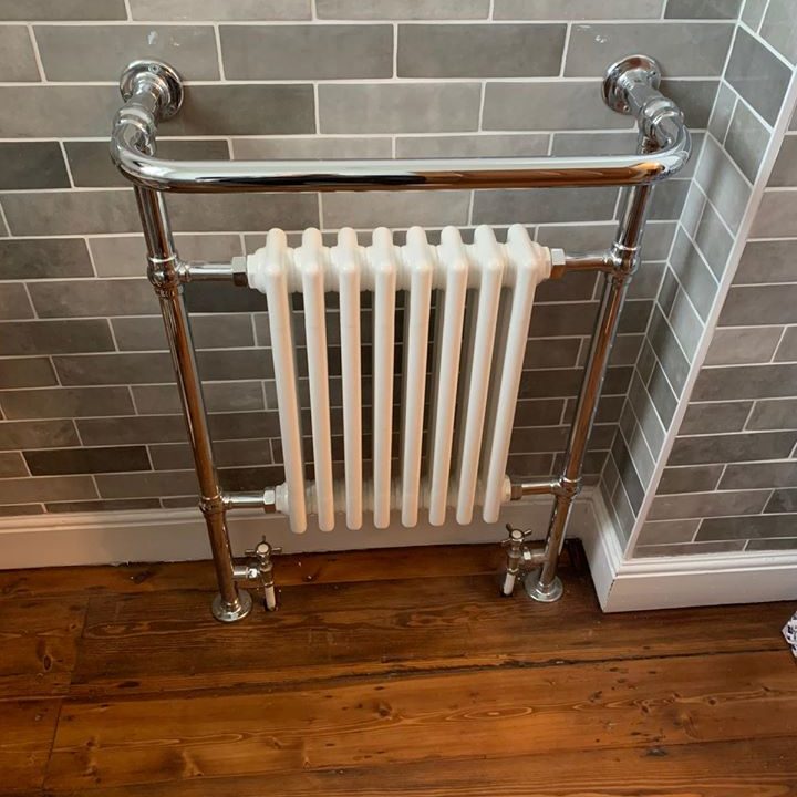 white designer radiator incorporated with towel rail