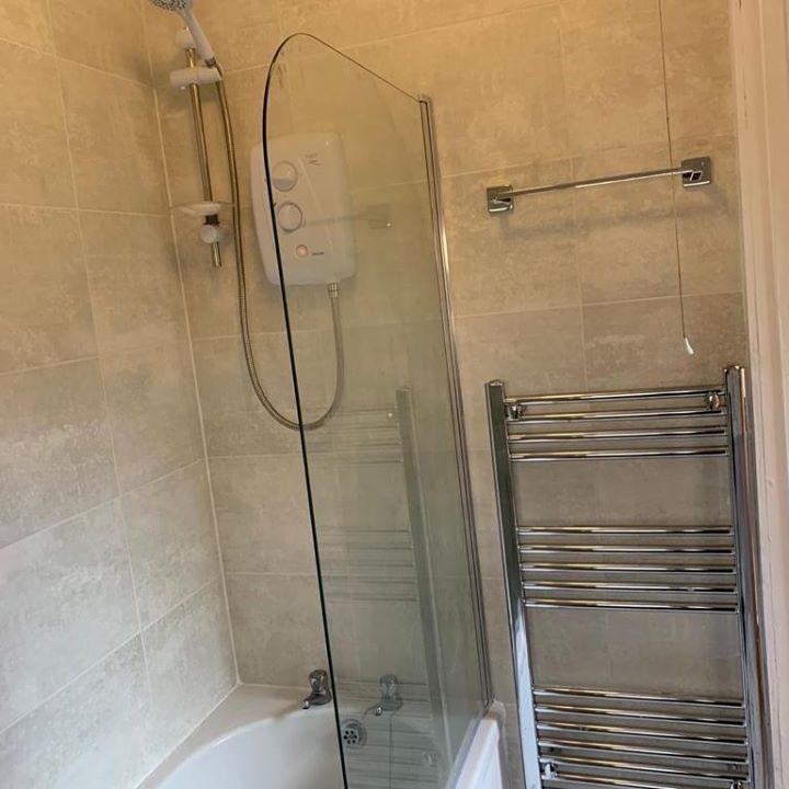 new bath with shower and heating rail